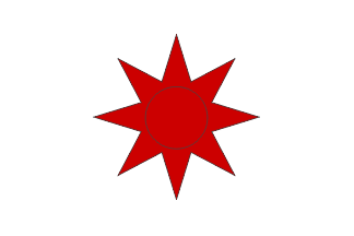[Japanese flag with disk replaced by eight-pointed star bearig a black circle.]
