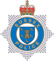 [Sussex County Police Badge]