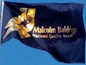 [Malcolm Baldridge National Quality Award flag]